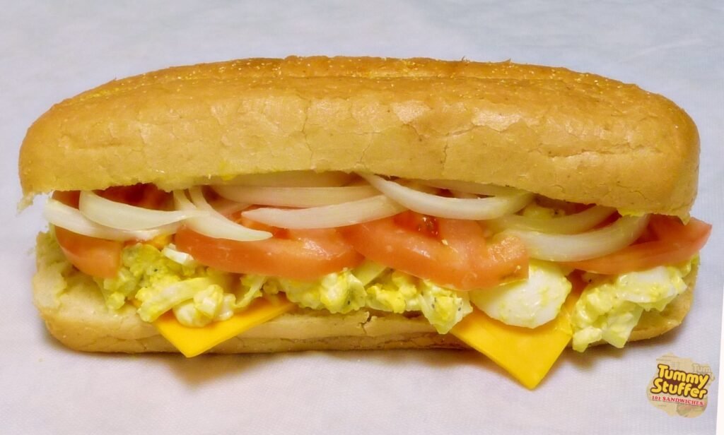 Freshly made house Egg Salad Sandwich on Squaw Bread with Provolone Cheese at Tummy Stuffer